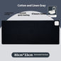 Black heated desk mat, 31 x 13 in, button controls with 4-hour timer (variant photo)